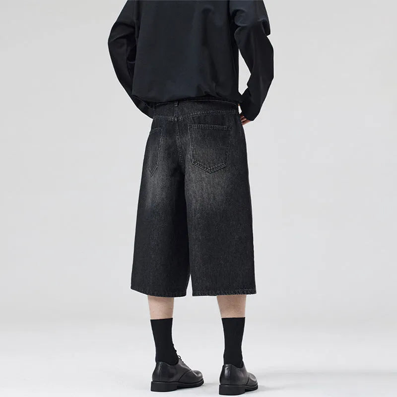 Men's straight leg cropped denim shorts in light blue, shown laid flat.