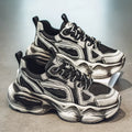 Men's black mesh sneakers with white rubber sole and platform heel on a plain background