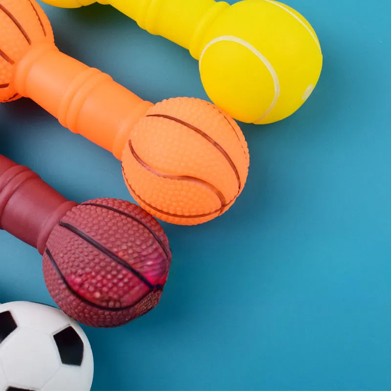 Brown, orange, white and yellow football dumbbell shaped squeaky dog chew toy.