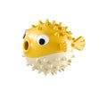 Green fish-shaped interactive dog toy with treat dispensing opening and textured surface for medium and large dogs