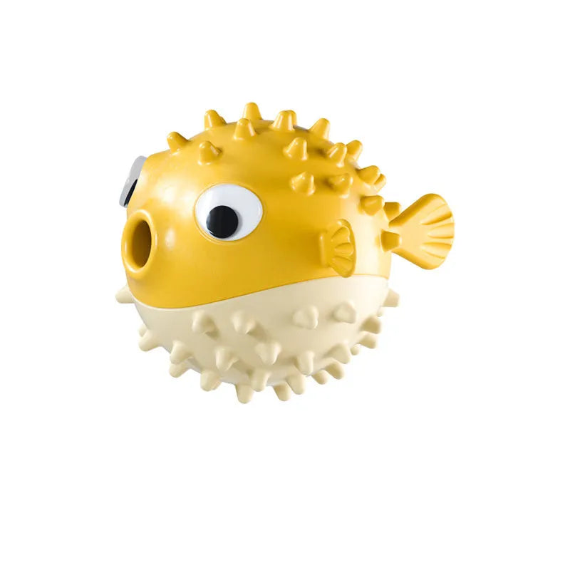 Green fish-shaped interactive dog toy with treat dispensing opening and textured surface for medium and large dogs