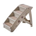 Foldable grey plastic pet ladder with non-slip stairs next to a sofa for small dogs and cats.