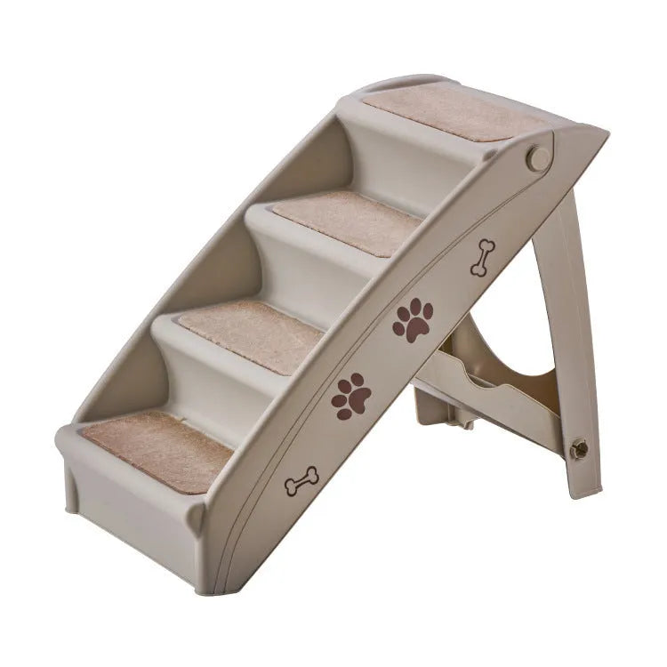 Foldable grey plastic pet ladder with non-slip stairs next to a sofa for small dogs and cats.