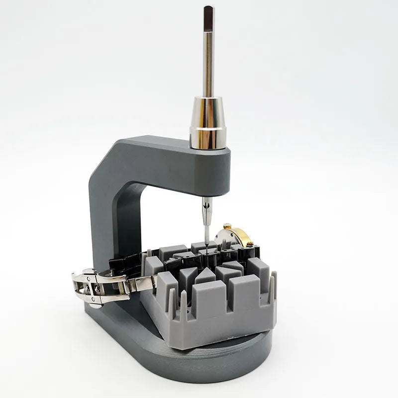 Silver professional press strap removal tool made of tool steel for watch and electronics repair.