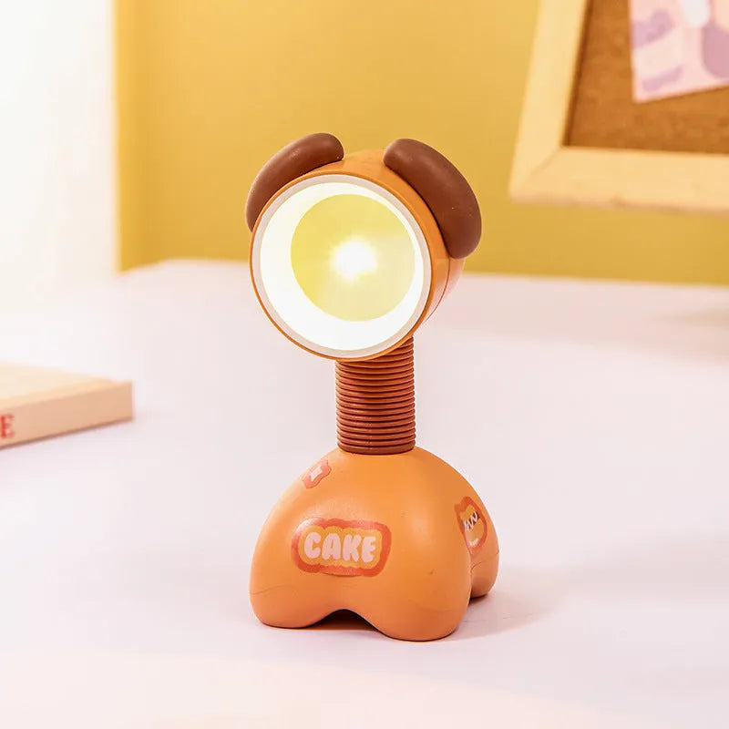 DIY cartoon animal small night lamp with magnetic base in assorted colours on a desk.