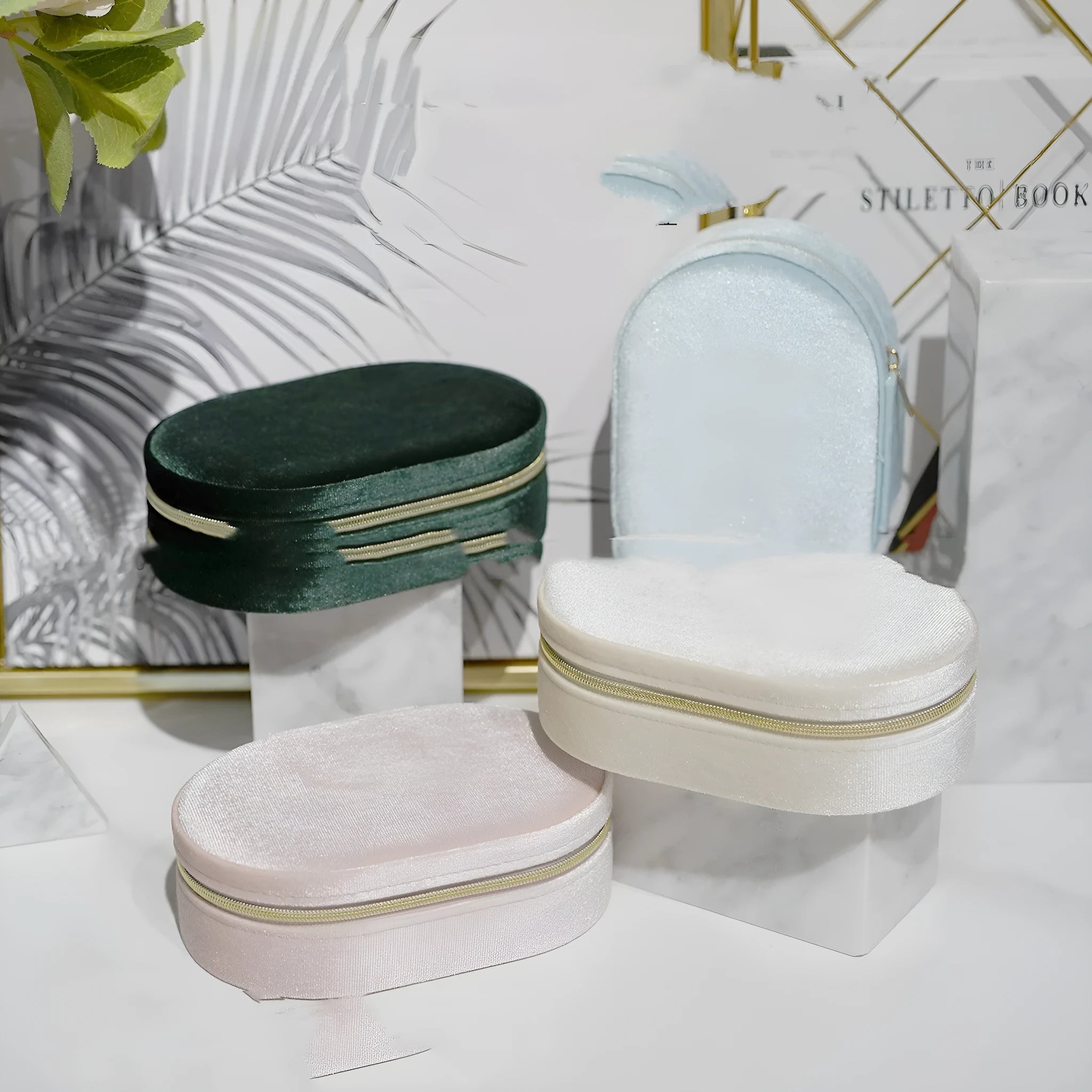 Oval shaped velvet jewellery storage box in multiple colours with flannel interior, measuring 15 by 10 by 5 cm.
