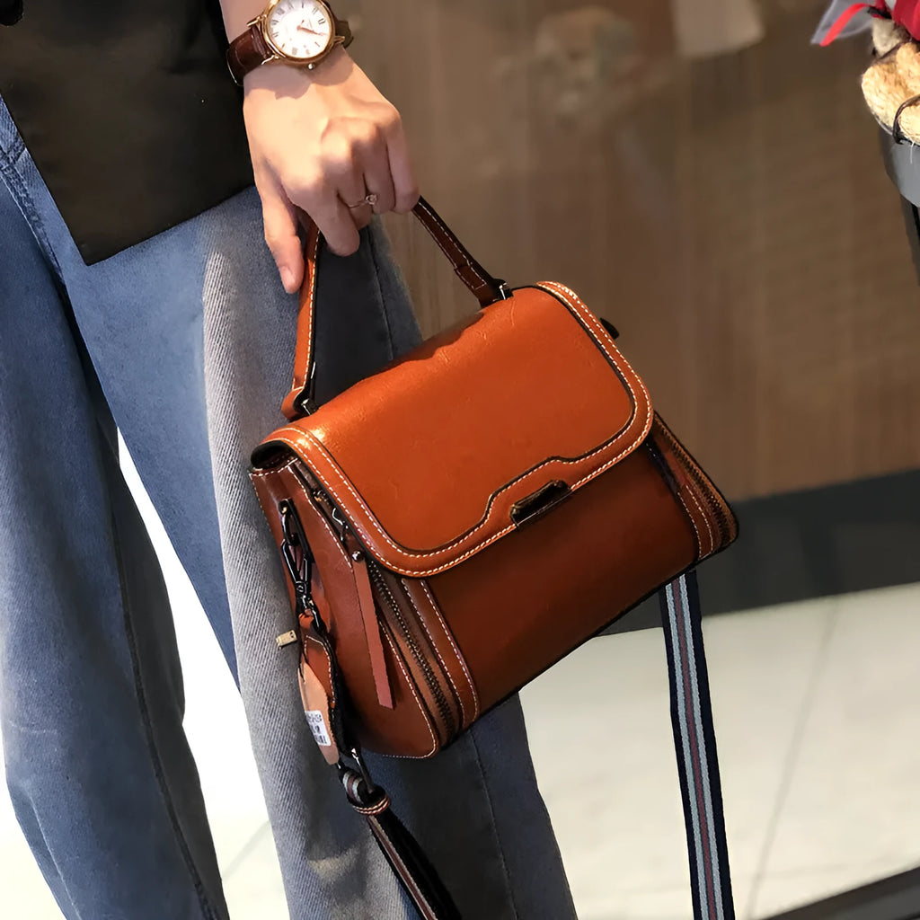 Women's retro style genuine leather messenger bag in horizontal square shape with multiple internal compartments