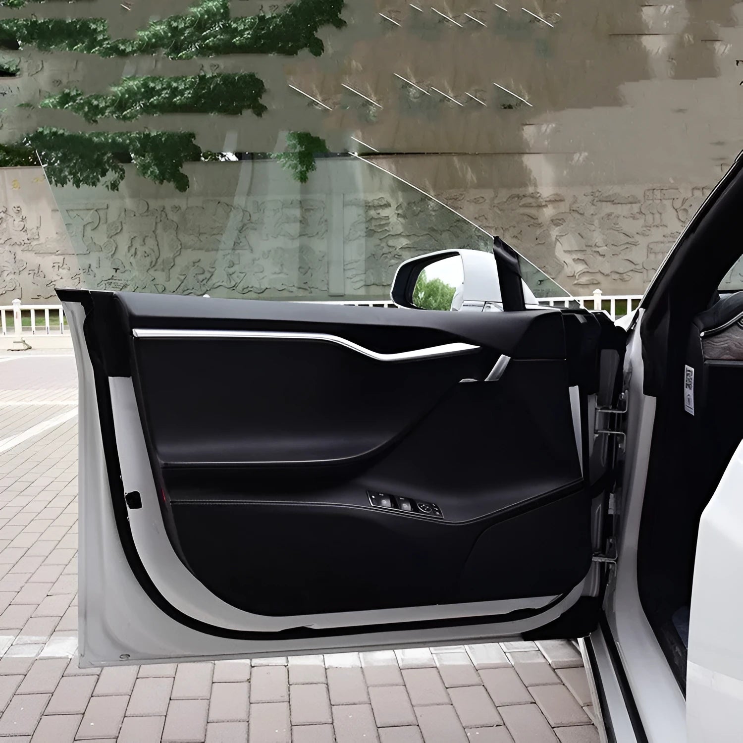 Tesla Model S door protective film package showing four transparent carbon fibre sheets for interior door panel protection