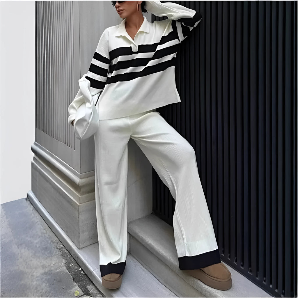 Women's black knitted two-piece set with polo collar top and straight-leg trousers.