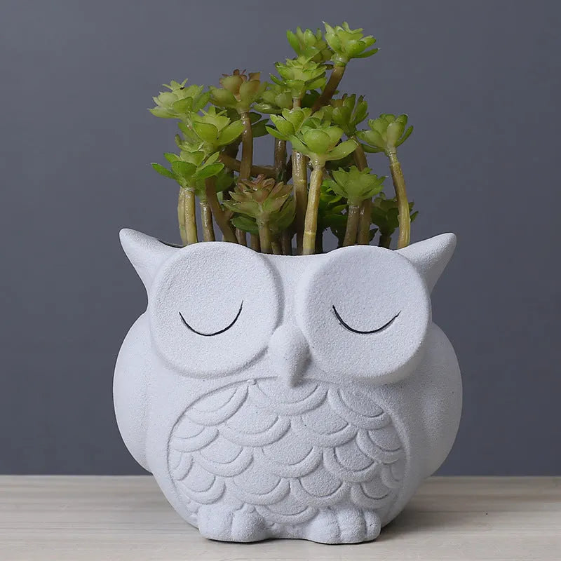 Handmade frosted ceramic flower pot with a cartoon owl design for small succulents.