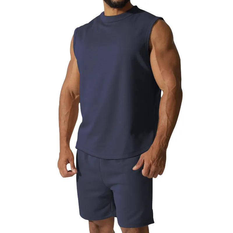 Men's sleeveless cotton blend sports suit showing sleeveless top and matching shorts in a solid colour.