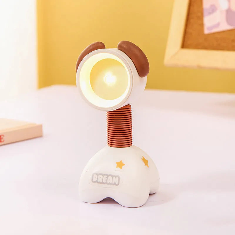DIY cartoon animal small night lamp with magnetic base in assorted colours on a desk.