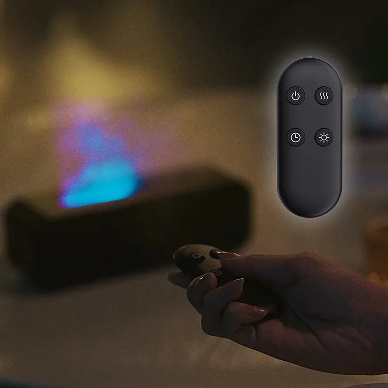 Black and white flame effect aroma diffuser with remote control on a table