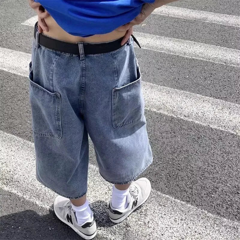 Men's blue washed denim pirate shorts with a high waist and cropped, straight leg.