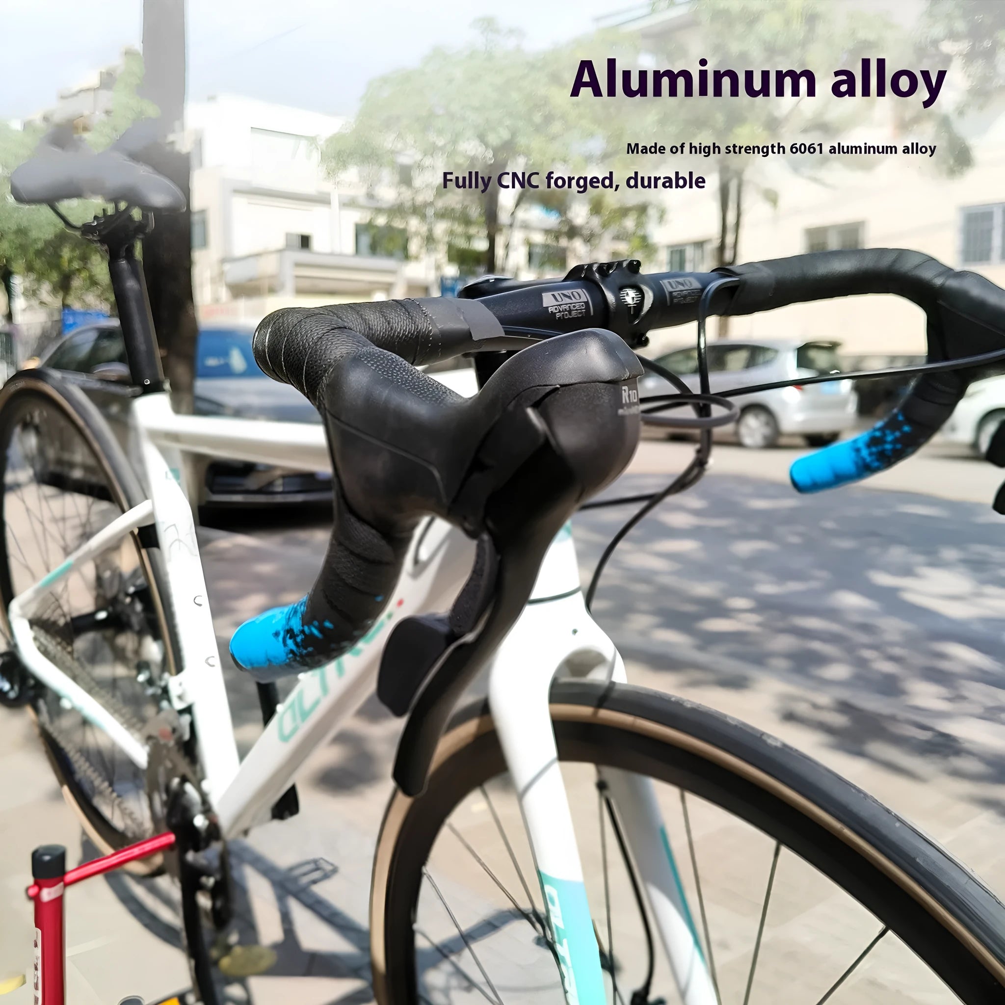 Black UNO aluminium alloy road bike racing drop handlebar showing shallow bend profile.