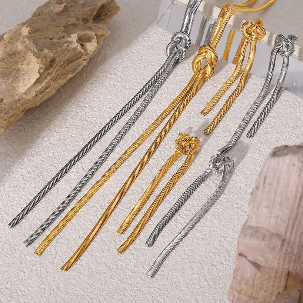 Gold knotted tassel necklace and matching earrings set on titanium steel snake chain