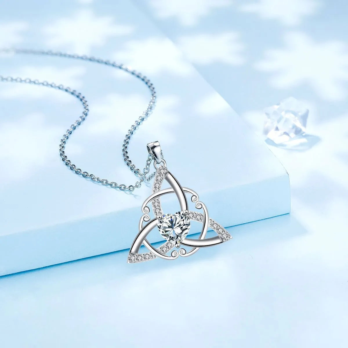 Women's Celtic knot geometric pendant necklace in copper with a choice of coloured electroplated finishes.