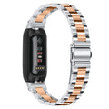 Stainless steel three-bead watch strap for Fitbit Inspire 3 in silver colour.