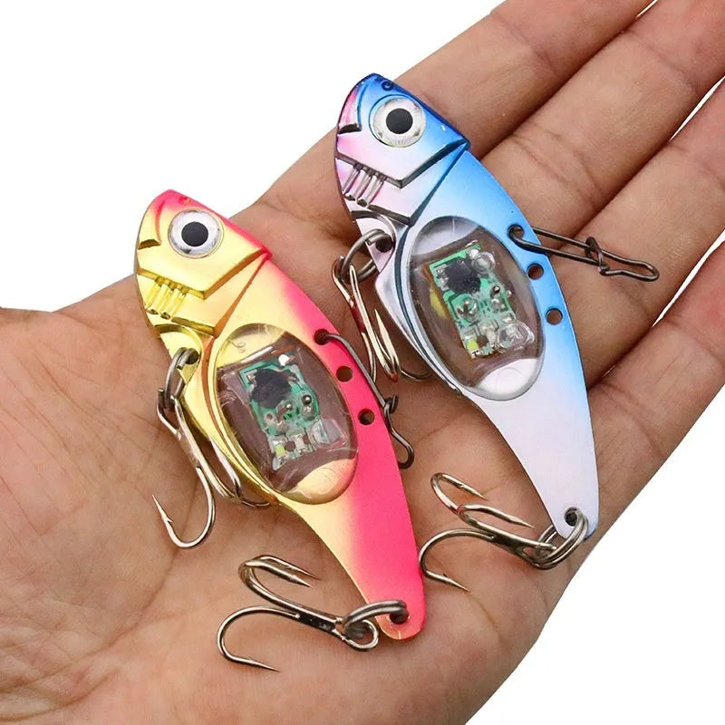 Electronic metal vib fishing lure with luminous elements in blue and red body colours