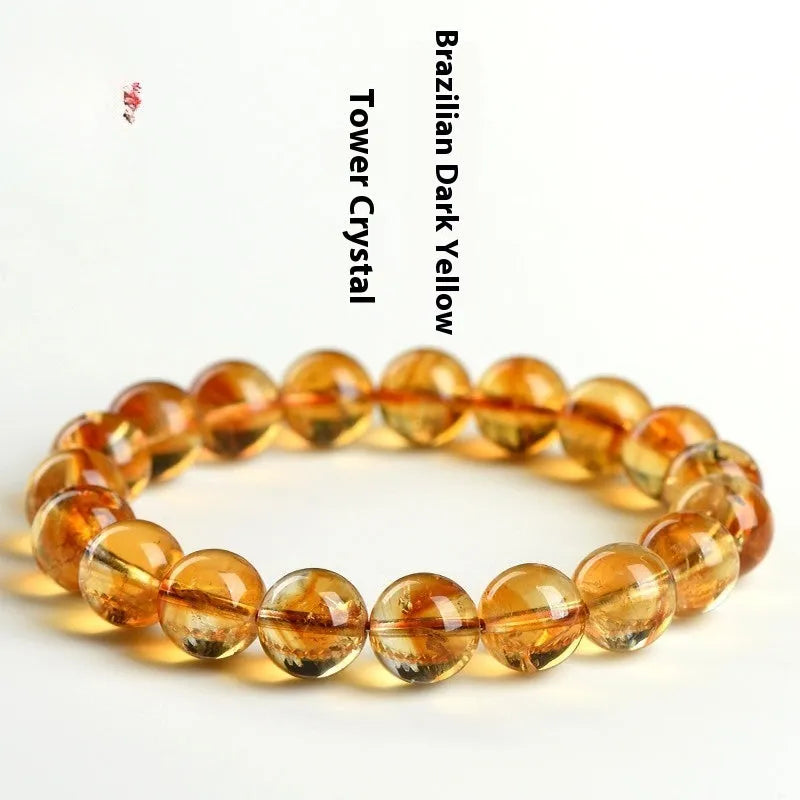 Natural yellow citrine gemstone bracelet showing geometric beads on a string.