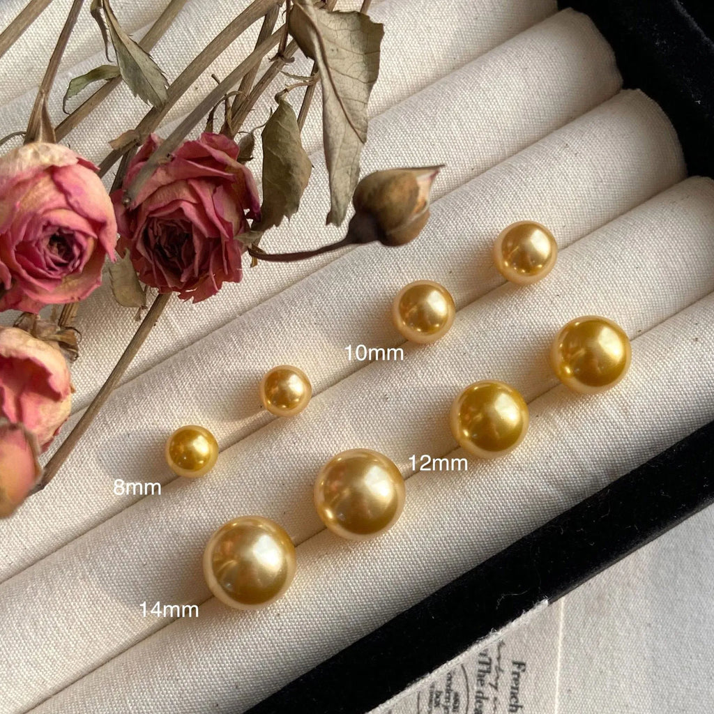 Geometric pearl stud earrings with retro styling in silver with eight-point star details