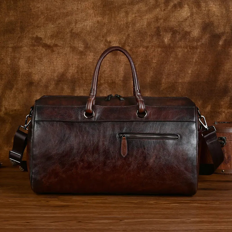 Handmade retro style brown leather shoulder bag with large capacity.