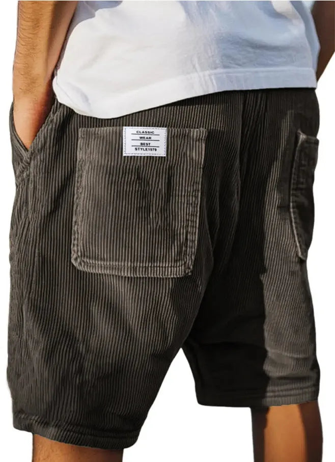 Men's grey straight-fit corduroy shorts with multiple pockets and a small embroidered logo on the leg.