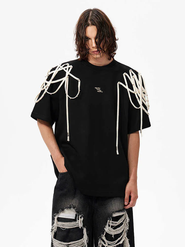 Black loose fit T-shirt with padded shoulders featuring rivet ribbon decoration and short sleeves