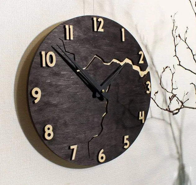 Modern simple wooden wall clock with crack design on a plain wall