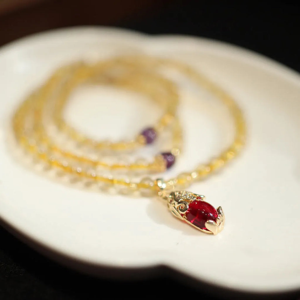 Natural Brazil gold rutilated quartz bracelet with Chinese style design featuring hanging chopsticks and three circles pattern