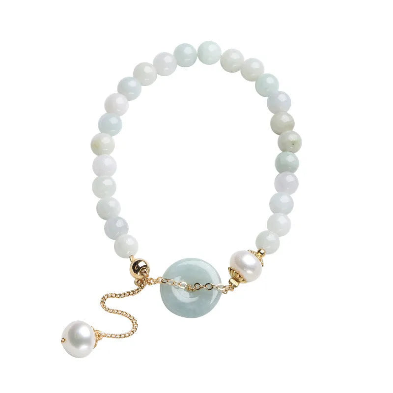 Natural jade bracelet with peace buckle fastener and white pearl accents, geometric pendant design