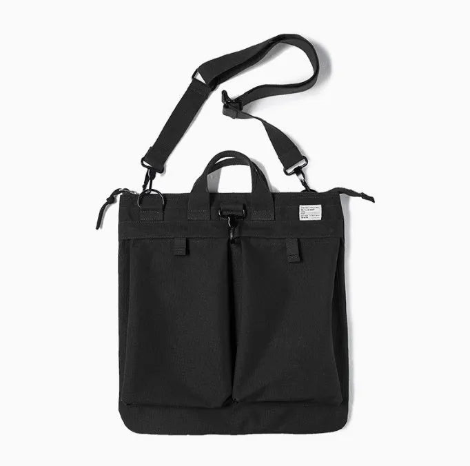 Marden Tooling charcoal black canvas messenger bag with crossbody strap, shown open to reveal laptop compartment.