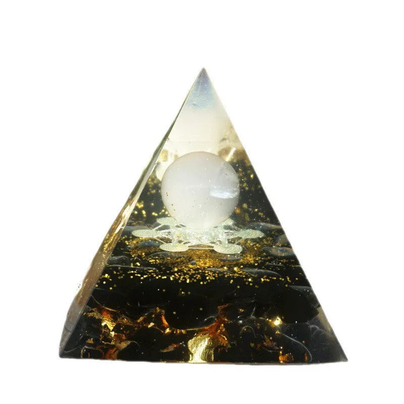 Clear resin pyramid ornament with embedded crystal gravel pieces, 6cm tall with hanging cord.