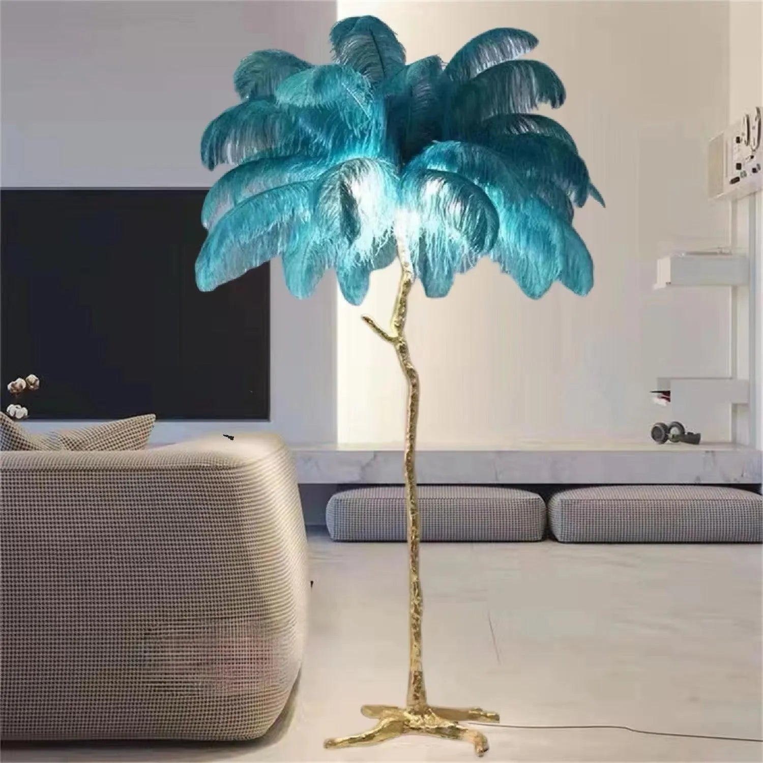 Tall decorative floor lamp with many white resin feathers, standing in a living room corner.