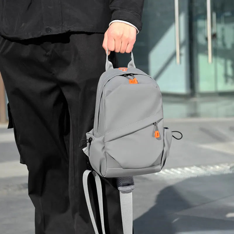 Men's black casual crossbody bag made from waterproof polyester material