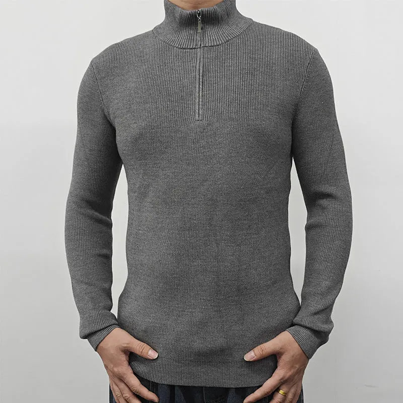 Man wearing a grey half turtleneck zipper sweater, a British style cotton blend pullover for spring.