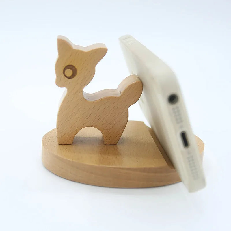 Decorative resin mobile phone stand in a choice of styles including animal figures and wood-effect designs.