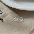 Adjustable copper love heart-shaped ring with electroplated finish on white background