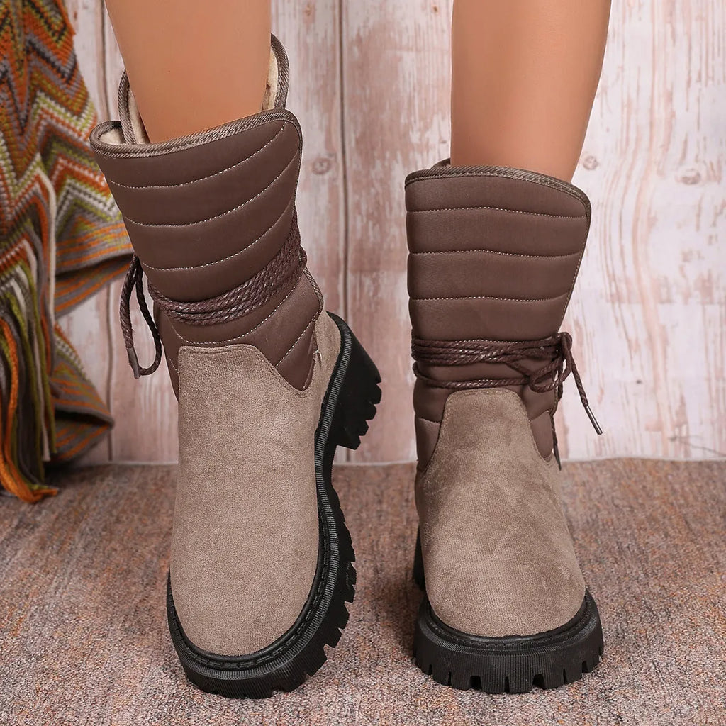 Women's black chunky heel snow boots with lace-up front and fleece lining