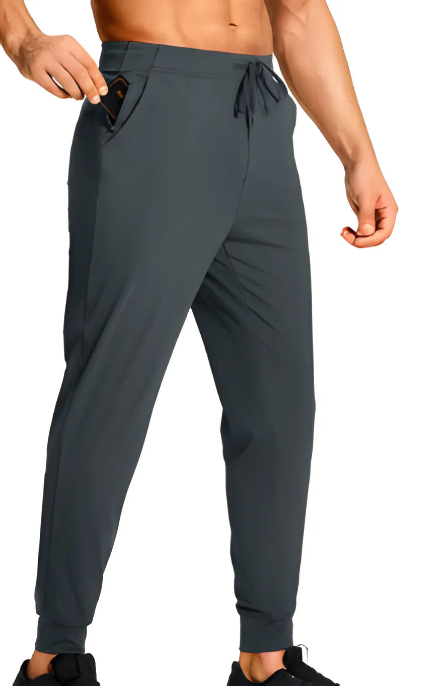 Men's solid colour loose casual trousers in polyester fabric on a hanger.