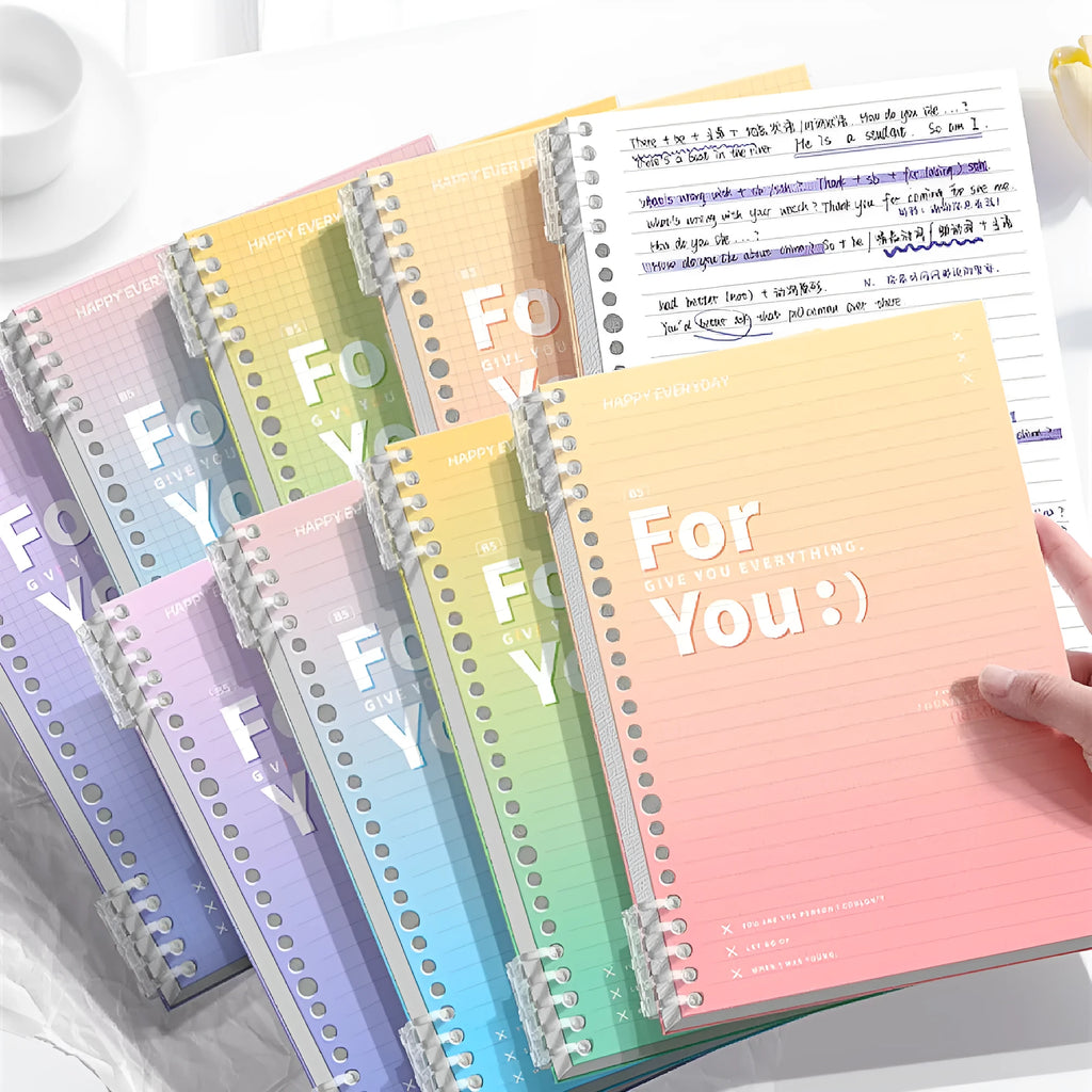 Removable coil gradient notepad in blue, green, pink, or purple, showing A4 and B5 size options.