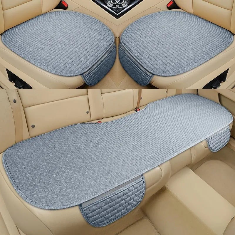 Linen car seat cushion in charm coffee colour, showing hemming detail, on a car seat.