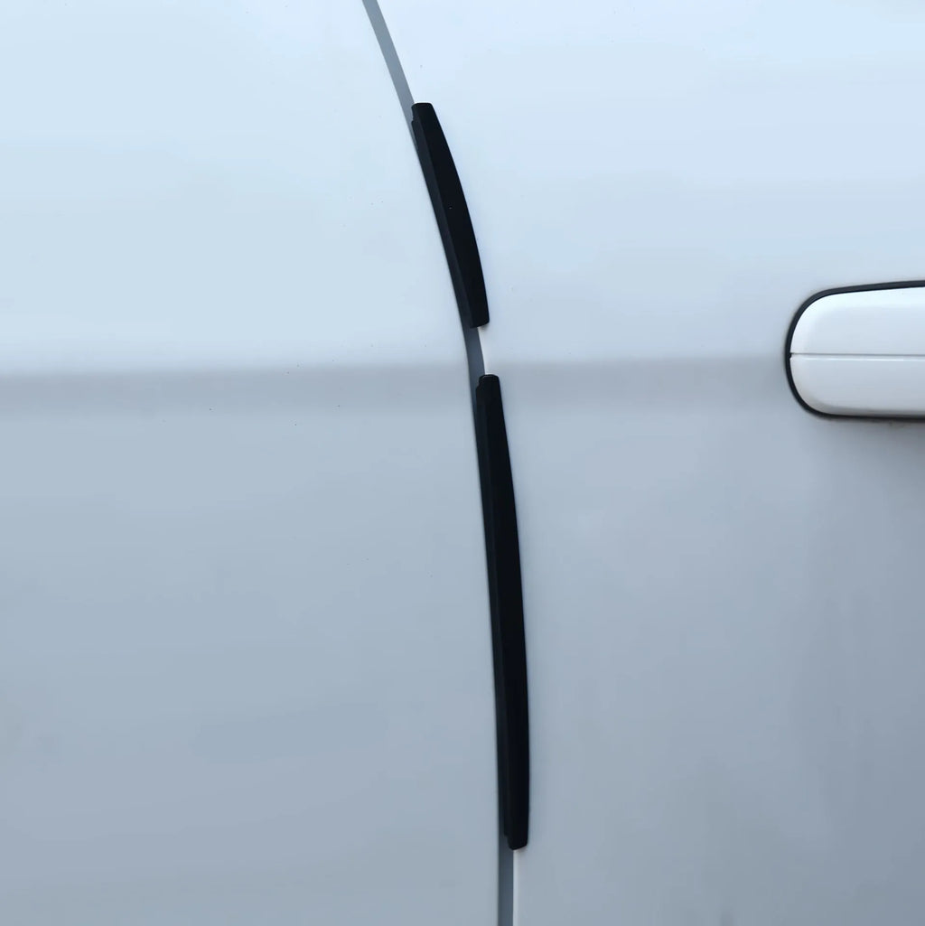 White solid colour plastic car door side bumper strip for edge protection.