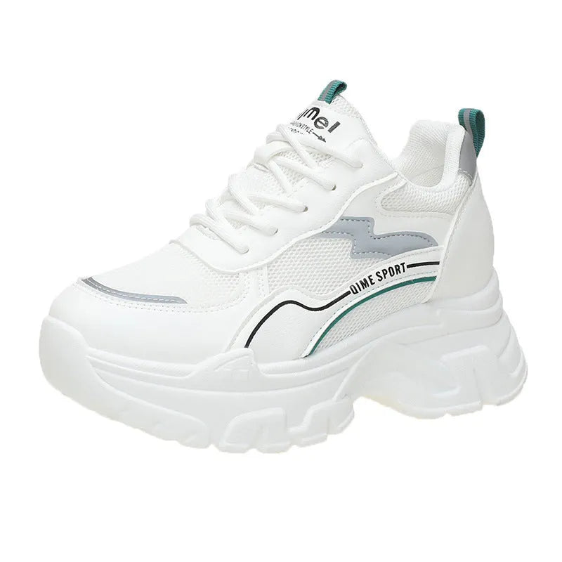 Women's white and beige height increasing dad shoes with cross straps and rubber sole.