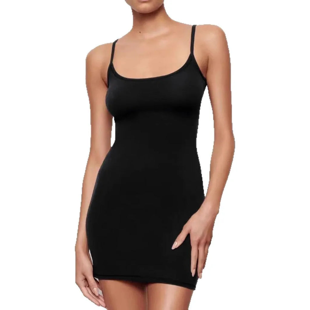 Black slim fit sleeveless sling sheath dress on a model, showing short skirt and mid-waist.