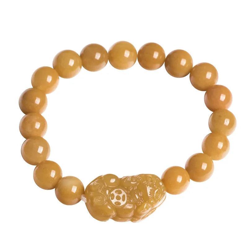 Personalised carved Golden Thread Jade bracelet showing bead detail and size comparison.