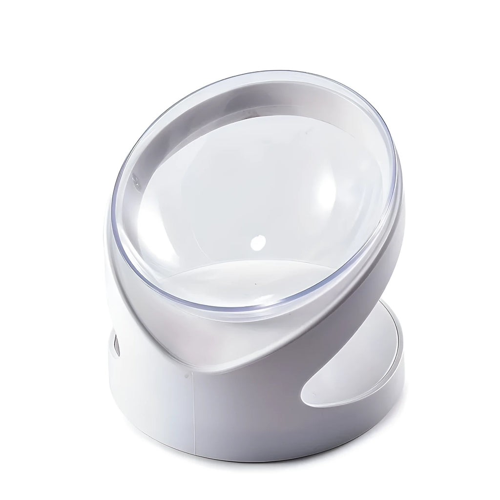 Clear plastic elevated cat food bowl with tilt design on white surface