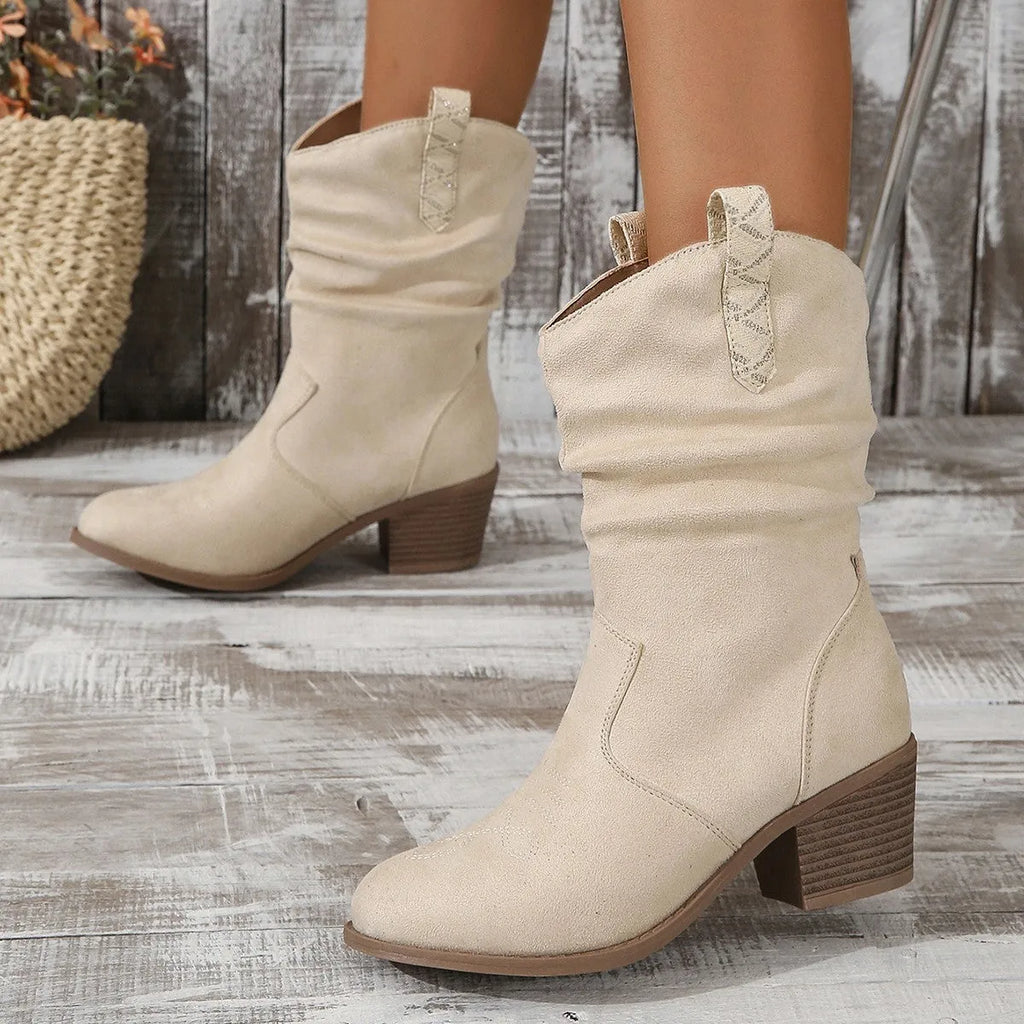 Women's suede mid-calf boots with chunky rubber sole in lotus root colour showing leather stitch detailing