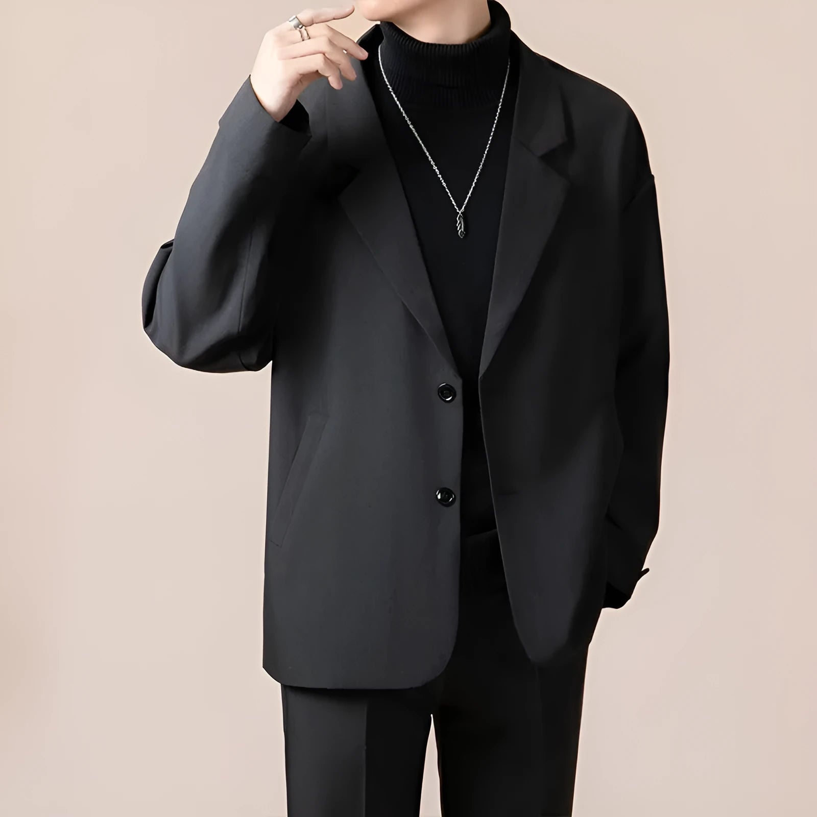 Men's loose fit light business style suit jacket in a polyester blend fabric, shown on a hanger.