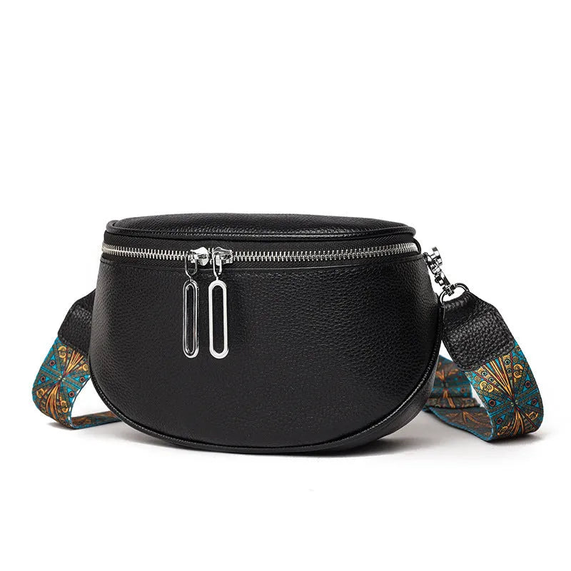Women's soft PU messenger bag in saddle shape with single shoulder strap and zippered interior compartment
